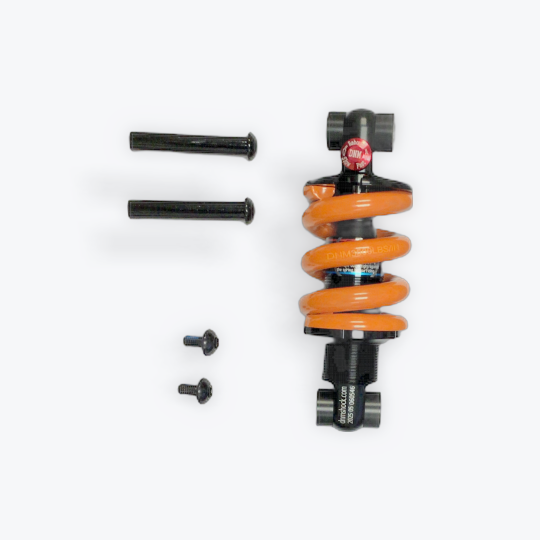 Orange shock absorber for electric scooter with hardware on a white background