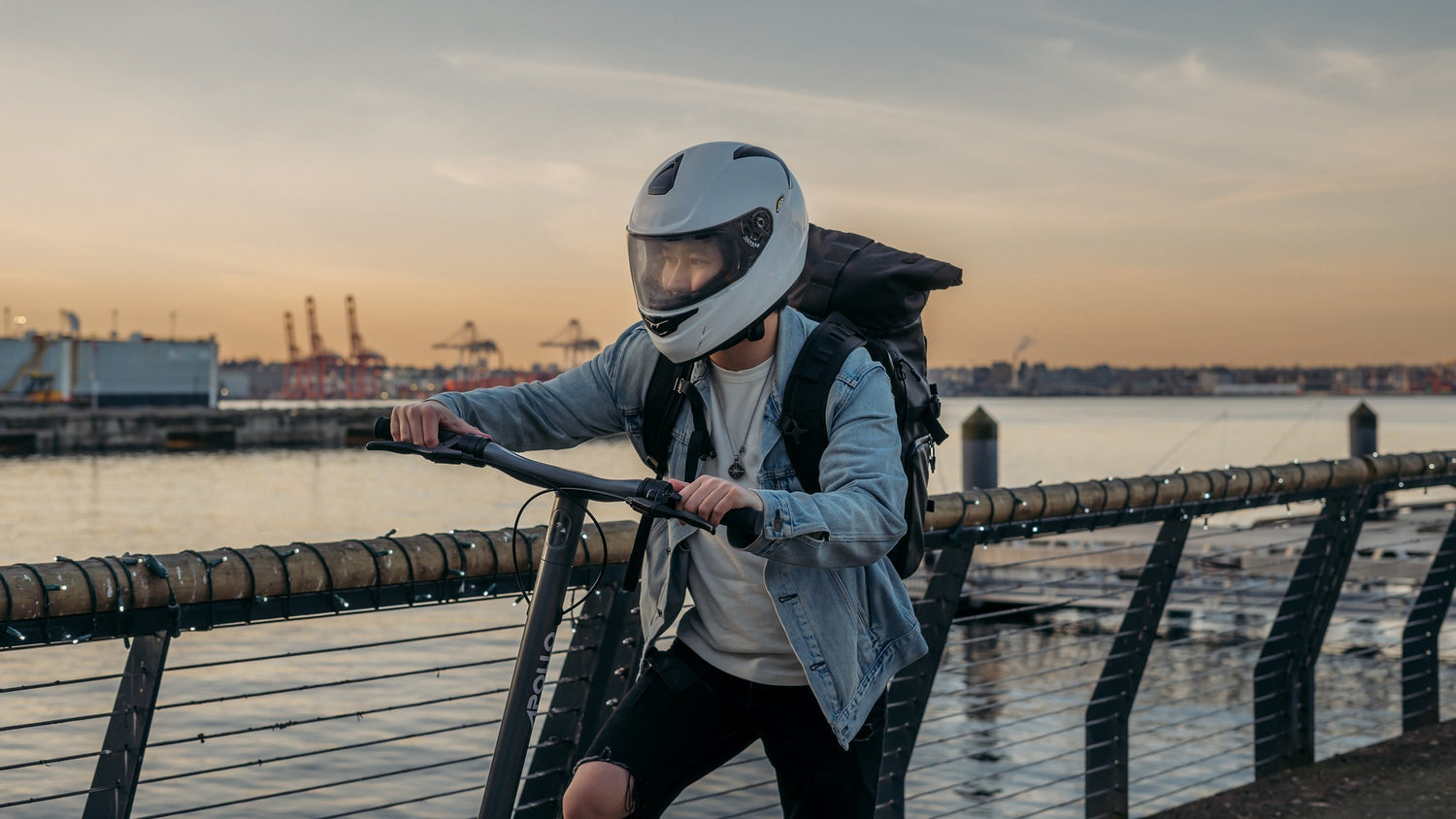 Image of a man riding an electric scooter in the city, demonstrating eco-friendly commuting and reducing carbon footprint with sustainable transportation