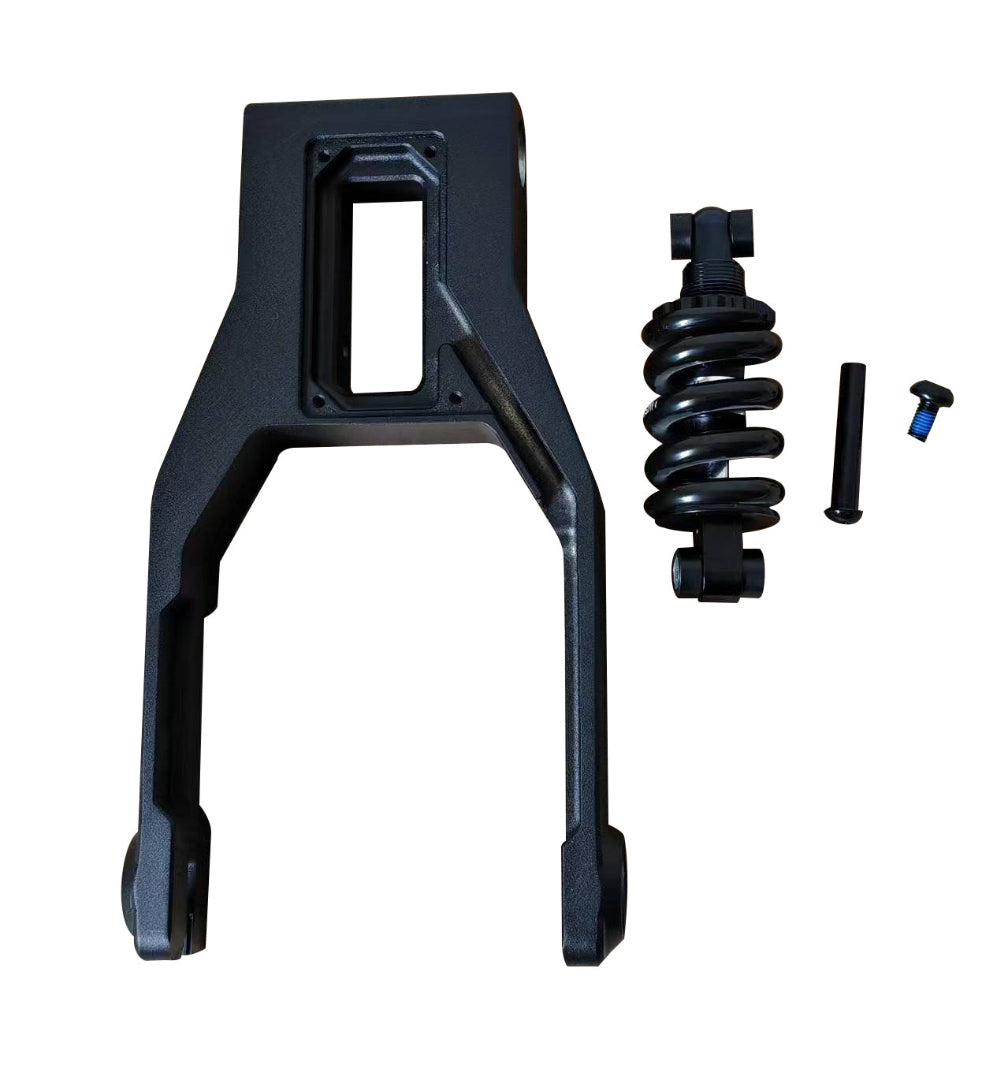 Black metal suspension component with coil spring and hardware on a white background