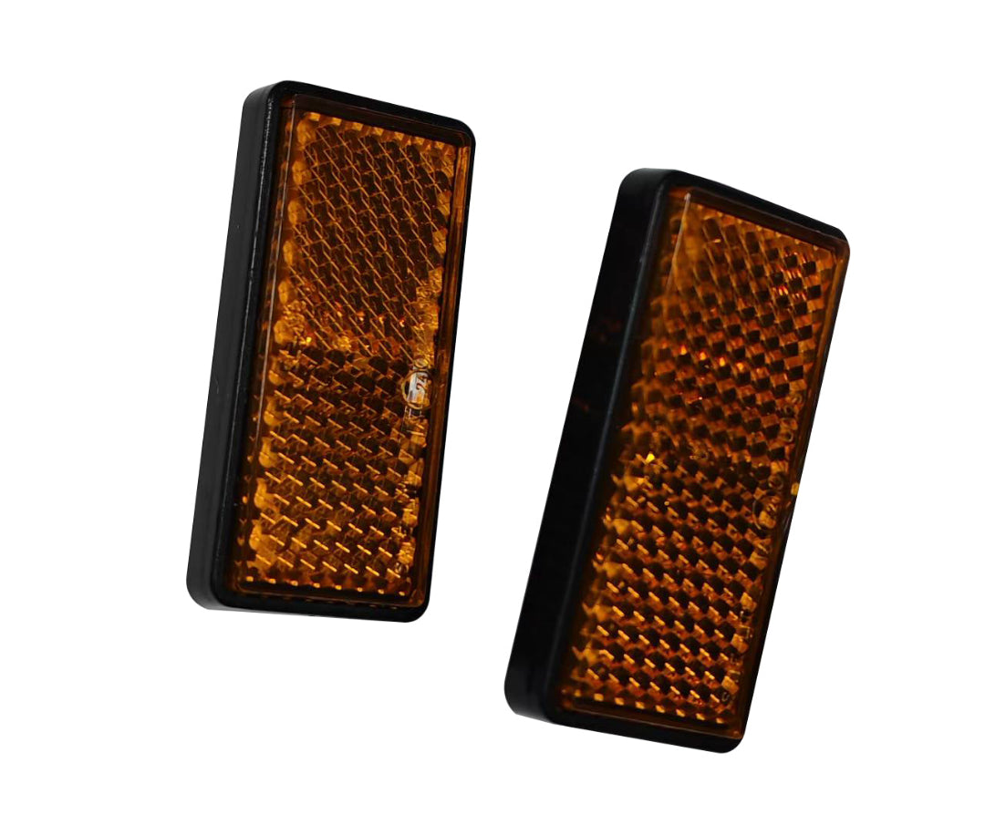 Two amber rectangular reflectors on a white background