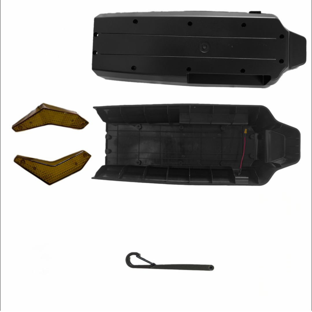 Black plastic components and tools on a white background