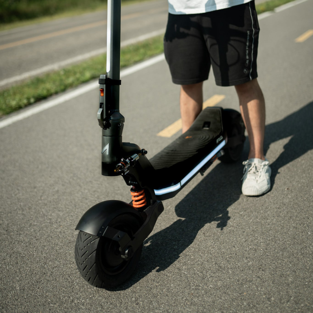 Apollo Phantom 2.0 Stellar electric scooter on the road with its rider