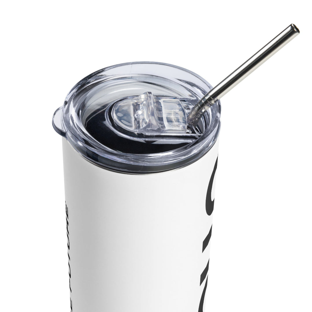 A stainless steel tumbler with a metal straw inserted into it, displaying a hot beverage. The tumbler appears to be white with a black design, possibly a logo, on the side.